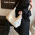 Women'S Medium Pu Leather Solid Color Basic Classic Style Sewing Thread Pillow Shape Zipper Tote Bag